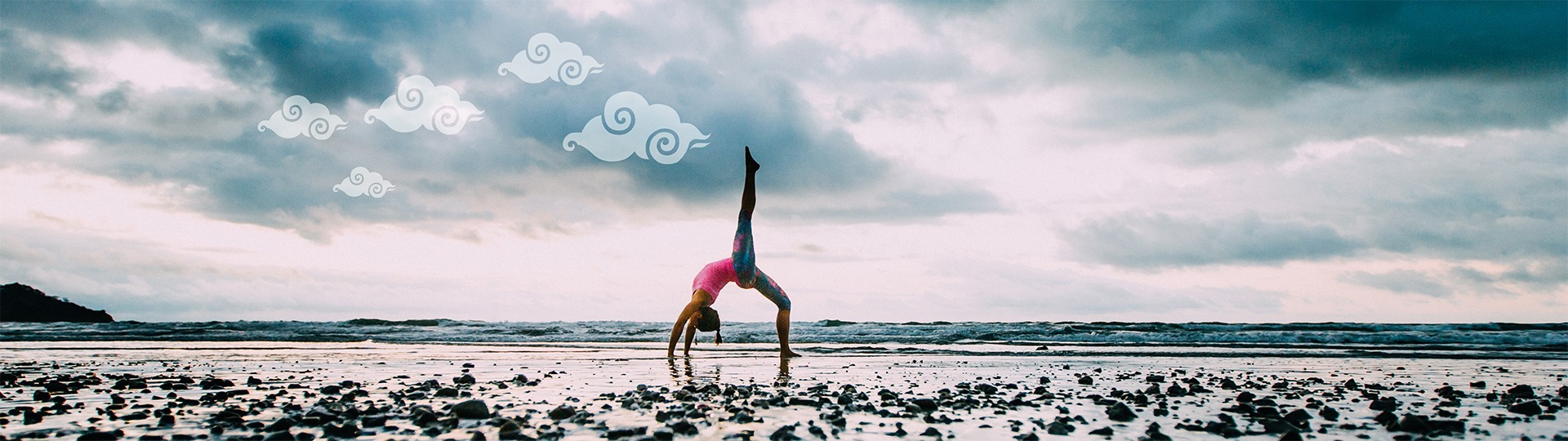 Tara doing a yoga pose on the beach