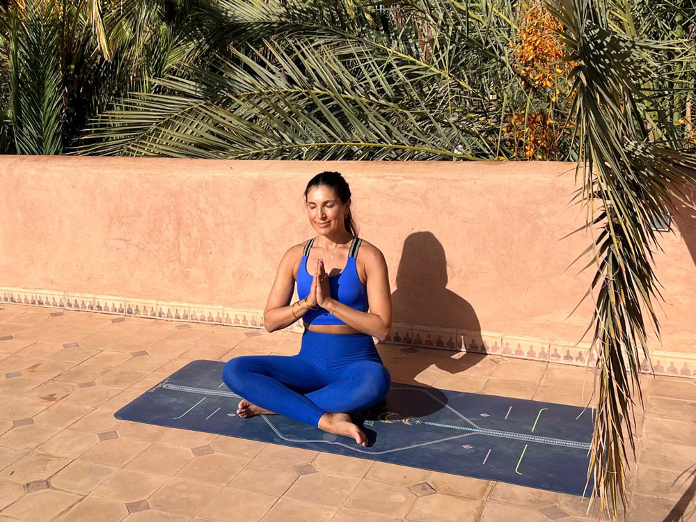 Tara doing yoga on holiday